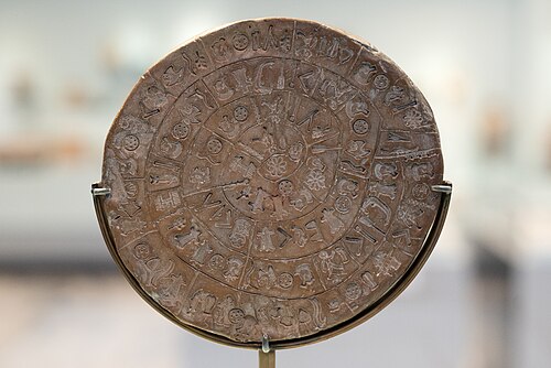Side A of the Phaistos Disc, showing spiraling stamped hieroglyphic-like symbols